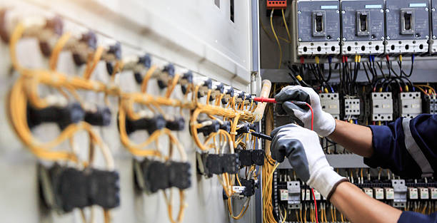 Professional Electrician technician working in Golden Glades, FL